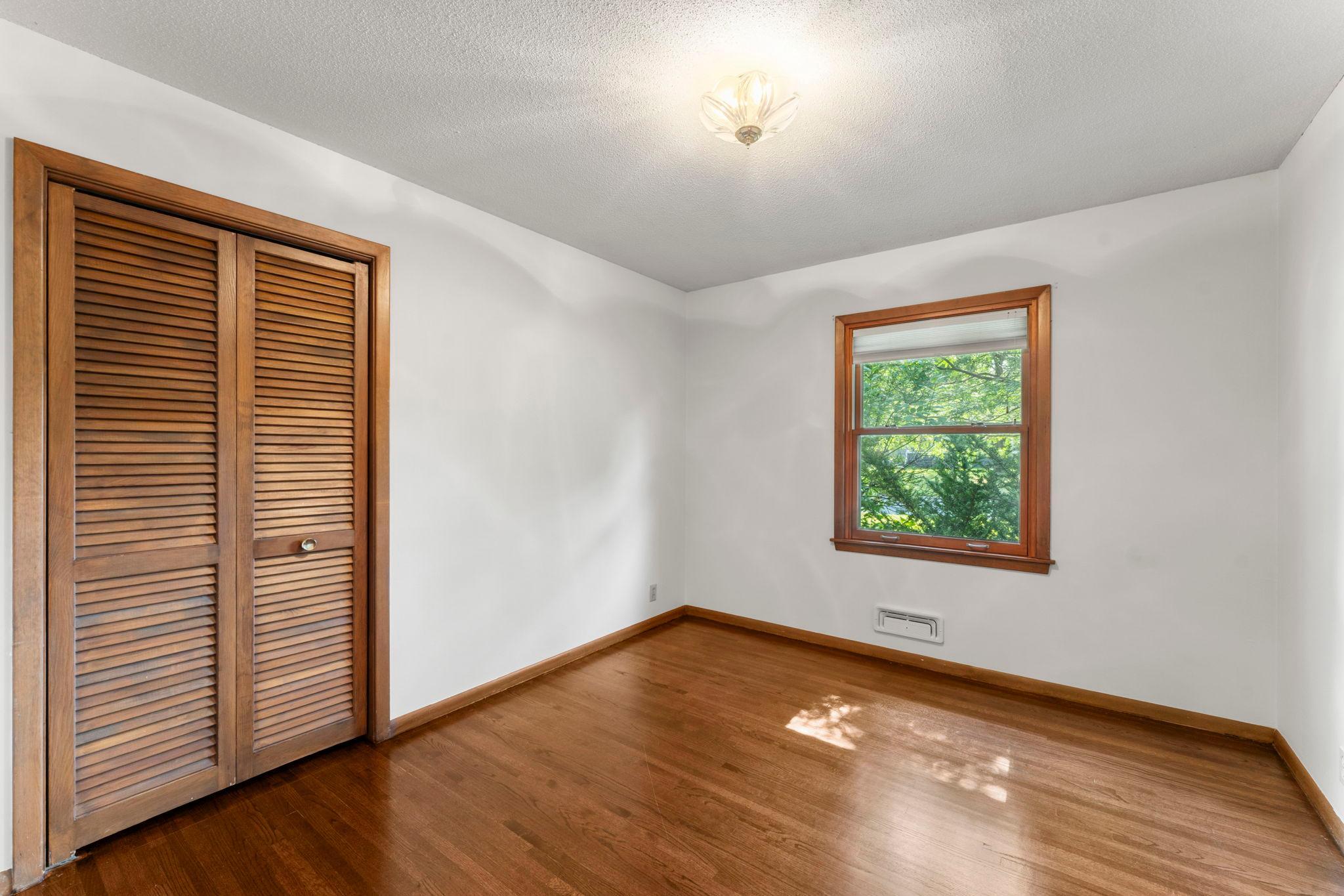 Three main level bedrooms offer flexibility for everyone, with hardwood floors throughout.