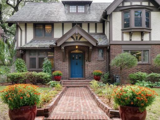 4 - Exterior Front, A charming brick walkway and mature plantings welcome you home.