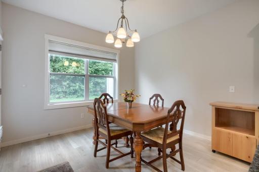 Nice dining space with atrium door with direct outdoor patio access.