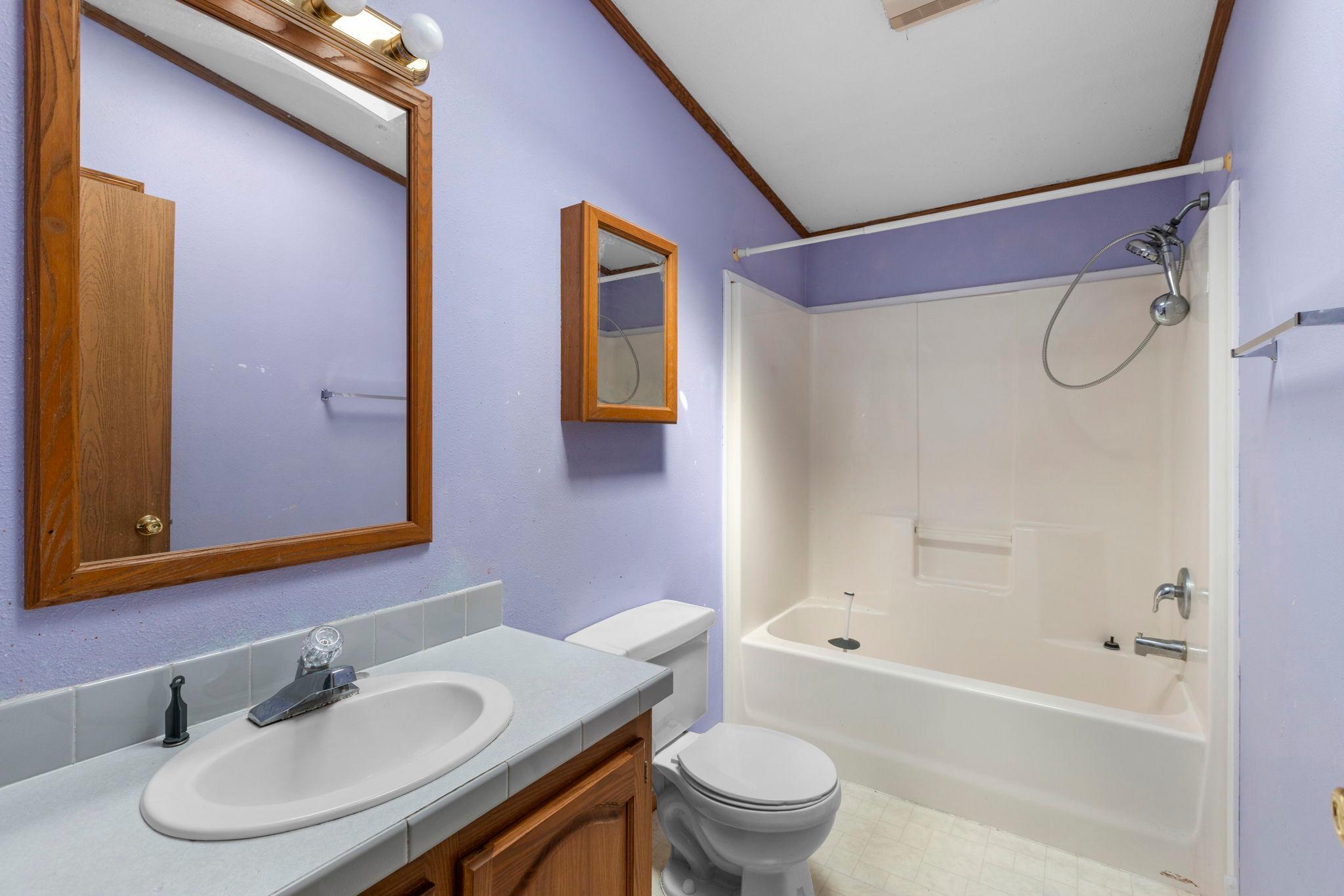 The third bath is conveniently located near the second & third bedrooms. Great for busy mornings!
