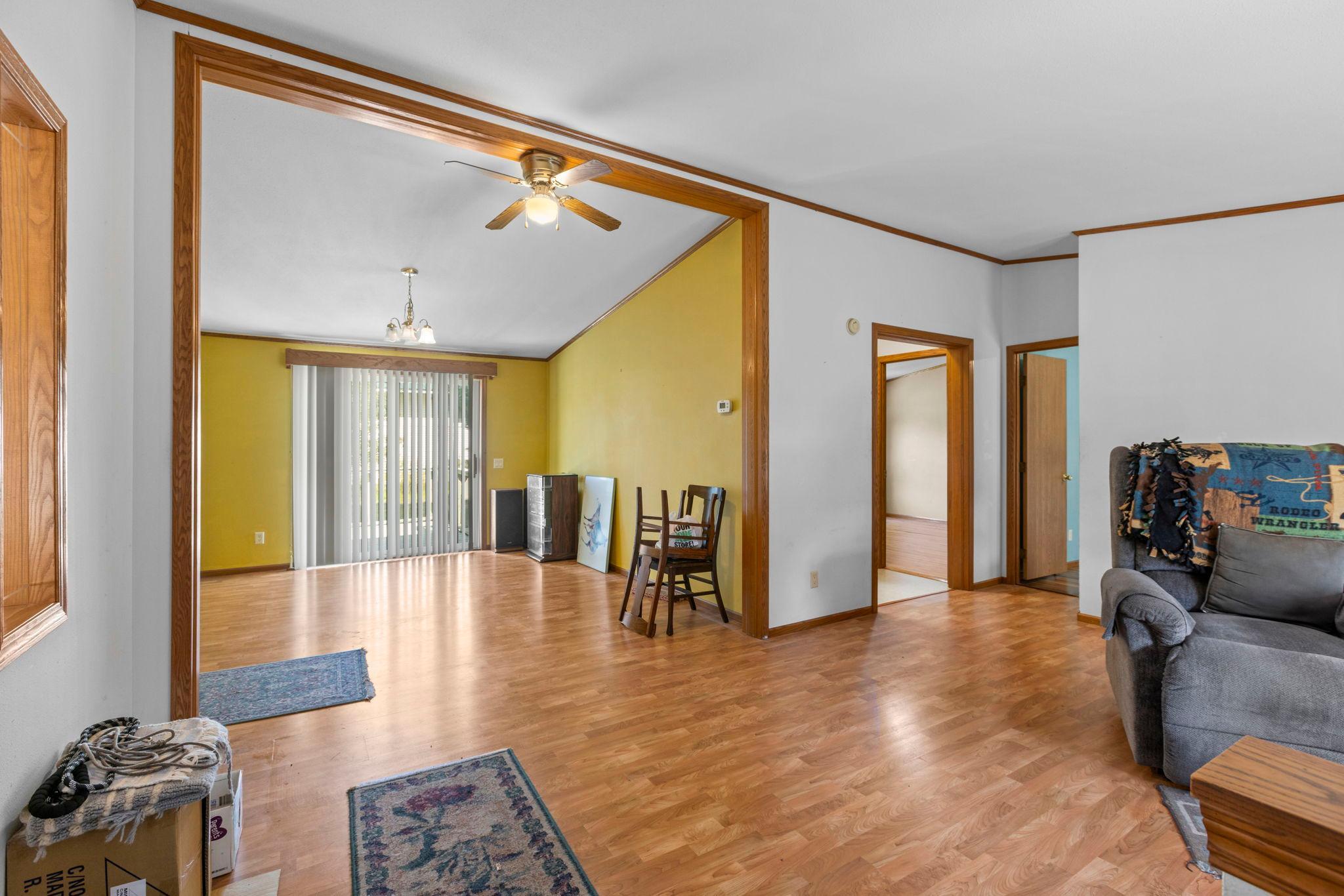 The living room leads to the dining room with plenty of space for a large table