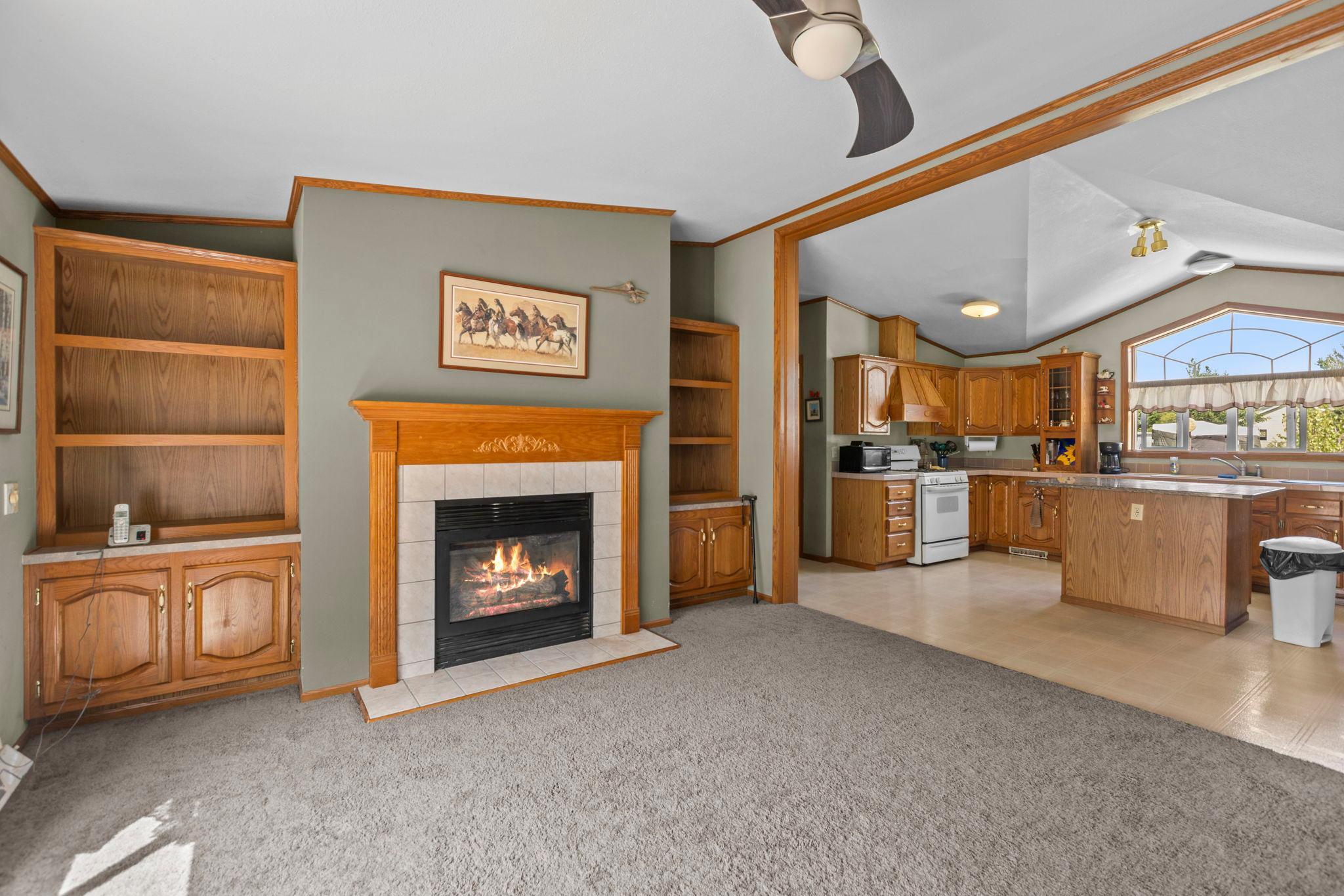The family room is a great space to gather with cozy gas burning fireplace