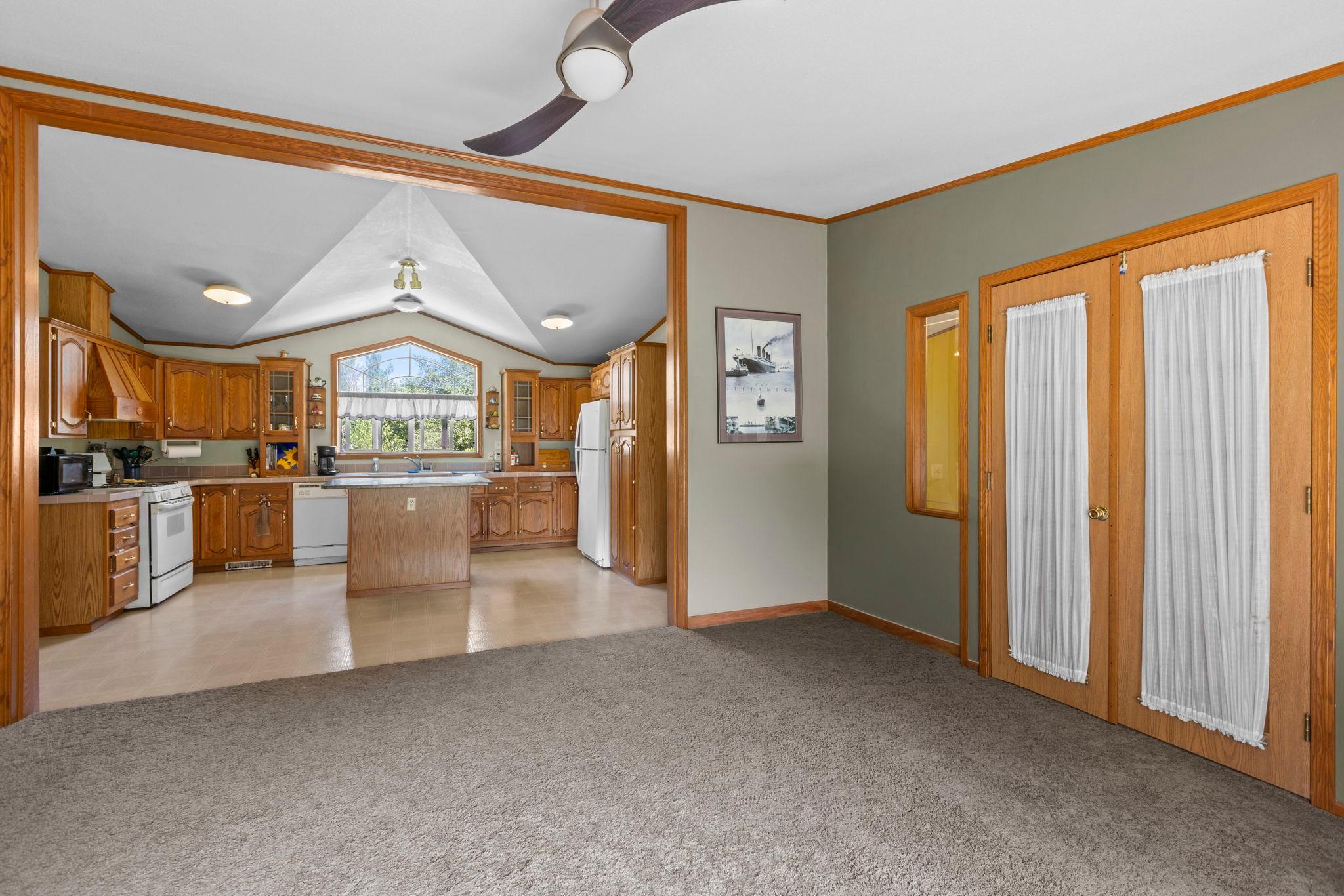 The family room has double doors leading to the living room and front entry