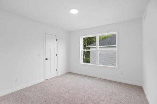 Three secondary bedrooms can be found upstairs, just down the hall from the ownerâs suite.