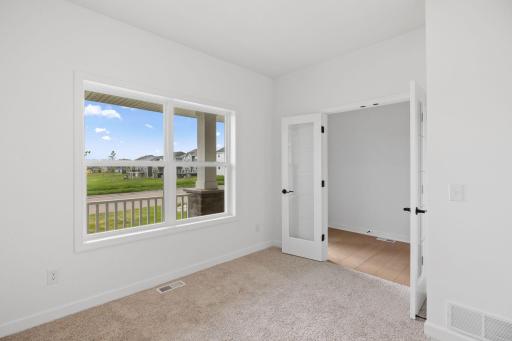 A first-floor office is situated just off the entry, ideal for working remotely or getting paperwork done.
