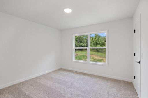 The secondary bedrooms provide spacious and private retreats for household members or overnight guests.