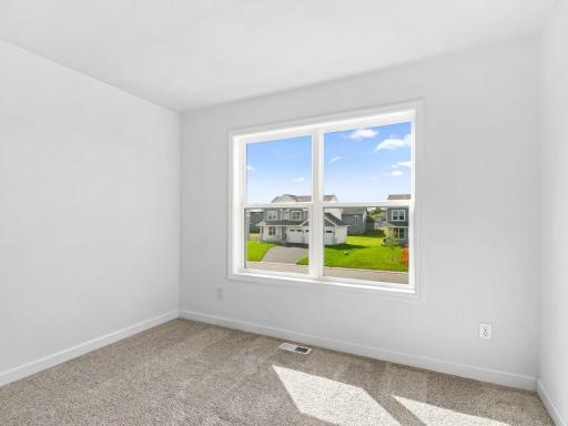 Three secondary bedrooms are located on the second level.