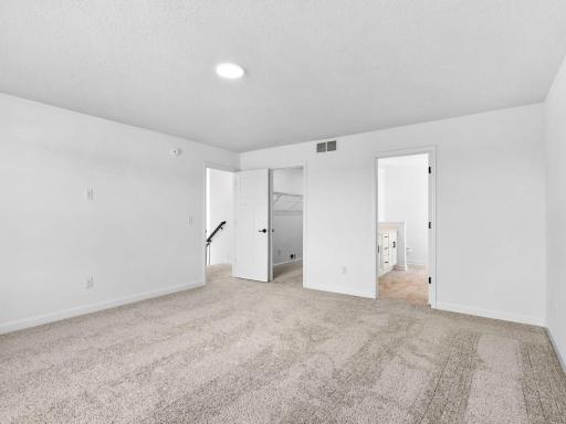 Plush wall-to-wall carpeting feels comfortable underfoot