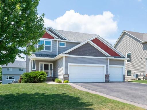 Exceptional curb appeal with a welcoming front porch.