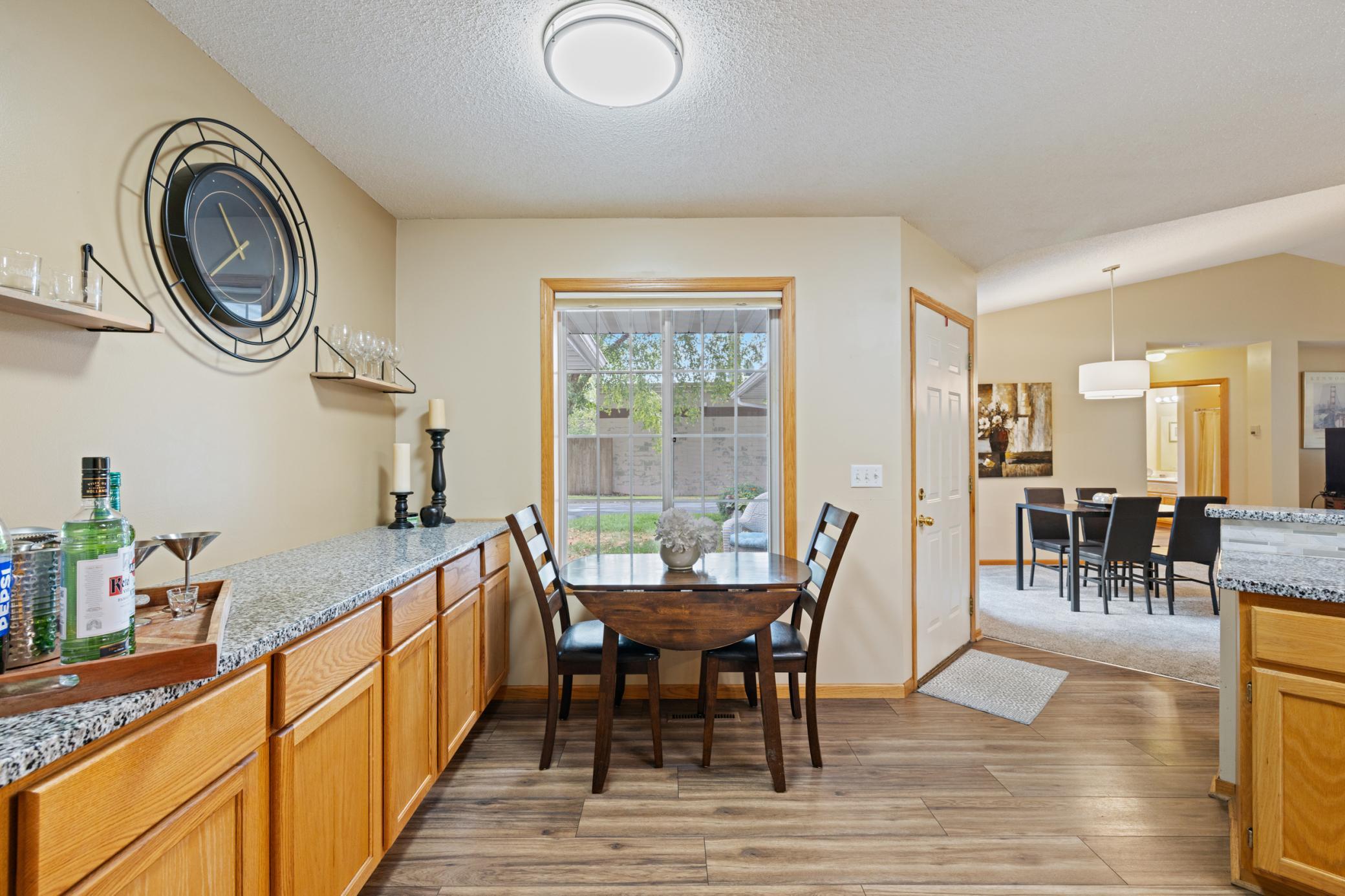 Breakfast nook with custom bar and cabnitry