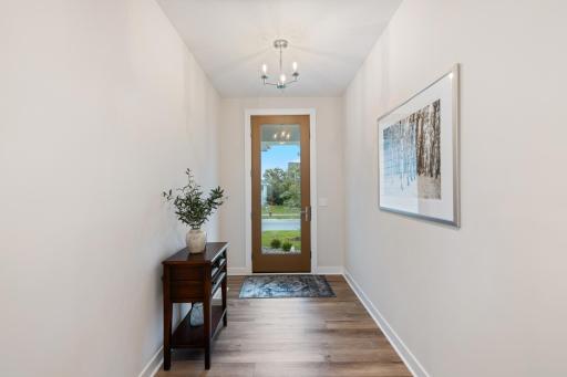 Stunnign front foyer greets your guests. The large window is totally private with UV tinting.