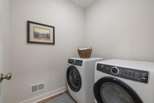 Handy laundry room off the main floor primary bedroom.