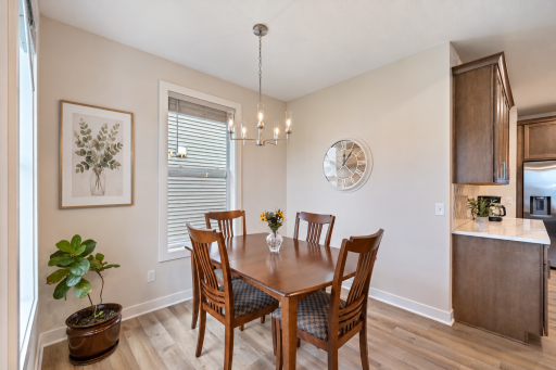 Dining area is bright with upgraded fixtures and beautiful windows.