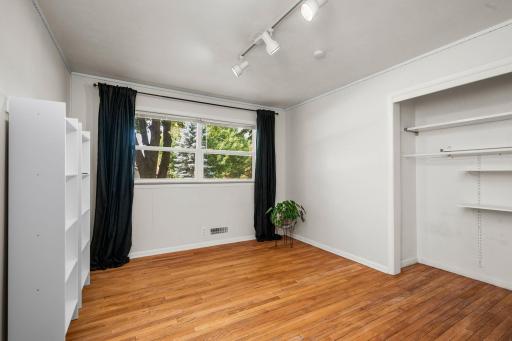 One of three bedrooms on main level. Hardwood floors!