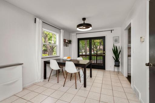 Nice dining room with easy access to screened back porch and back yard fun