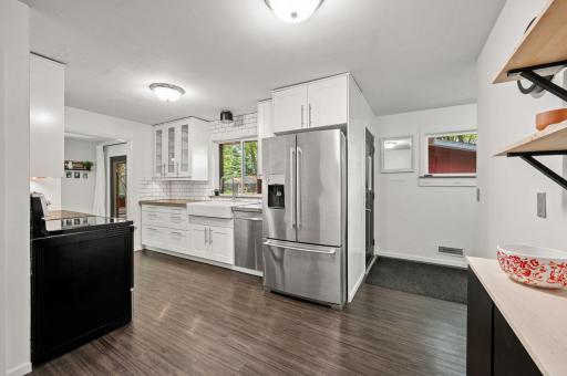 New flooring. Glass cabinets add an added flair