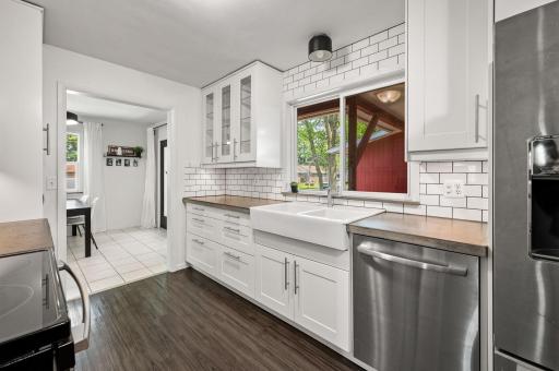 Custom subway tile backsplash, farmhouse sink