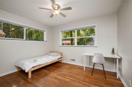 One of three bedrooms on main level. Taller window allows room for furniture!