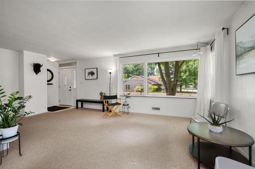 Large picture window in living room frames the outdoors