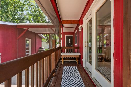 Screened in back porch is a perfect perch to take in the outdoor setting