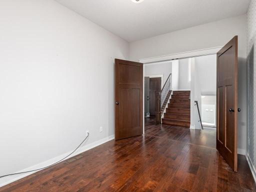 Versatile main floor office/flex space with beautiful hardwood flooring and neutral décor.