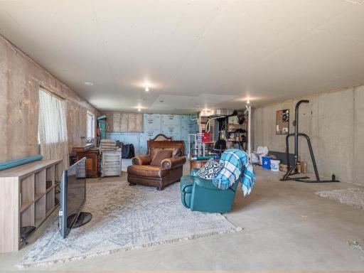 Expansive unfinished lower level with tremendous potential, perfect for future recreation room, home gym, workshop, or additional living space.
