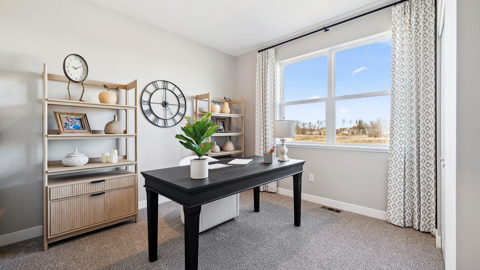 Currently staged as an office, the Jordan's 5th bedroom and a 3/4 bathroom are located on the main floor! This is a great option for visitors on an extended stay. Photo of model, colors and finishes may vary.
