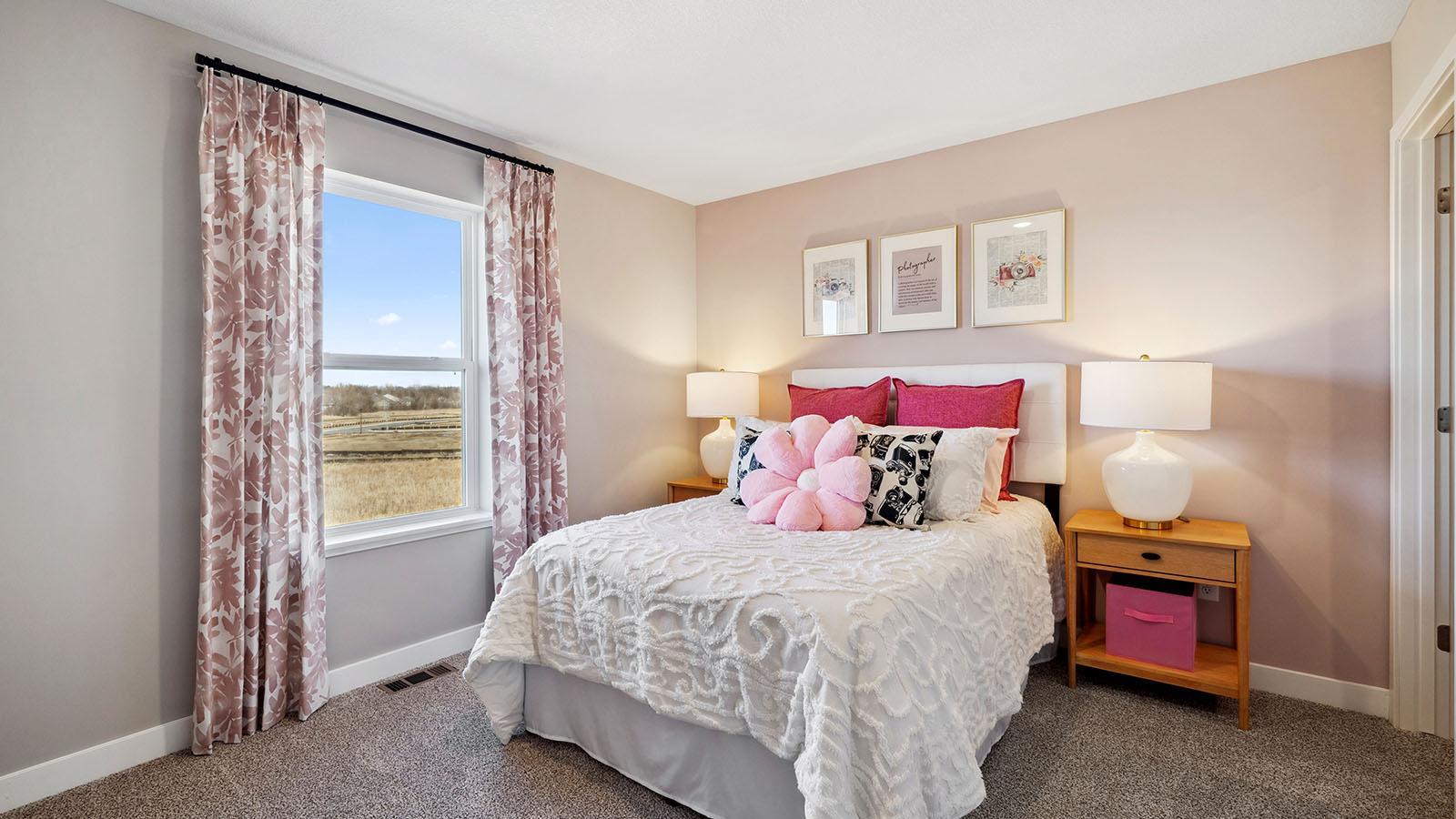 All three upper level bedrooms have large windows and walk-in closets. Photo of model, colors and finishes may vary.