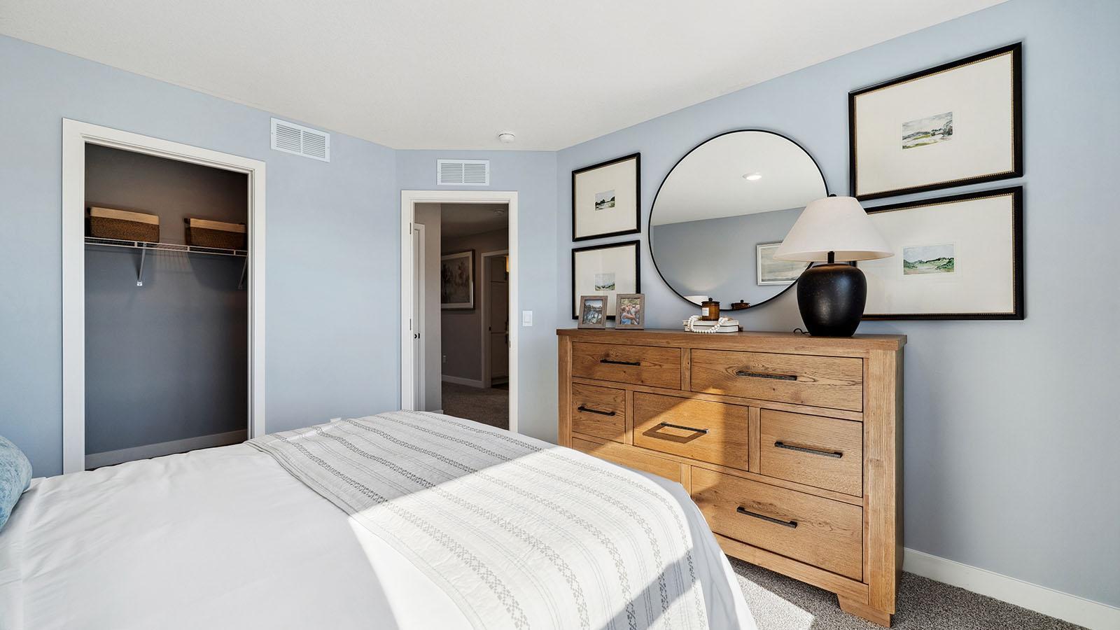 All three upper level bedrooms have large windows and walk-in closets. Photo of model, colors and finishes may vary.