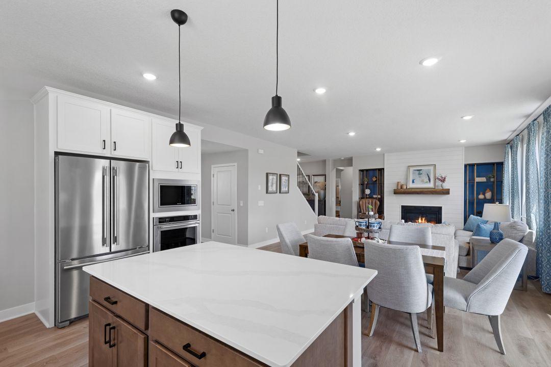 The main level has a fantastic flow between the kitchen, dining, and living room. This Jordan floor plan is great for entertaining and everyday living. Photo of model home, colors and finishes may vary.