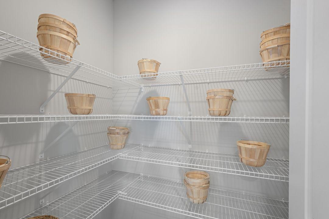 Large kitchen pantry. Photo of model, colors and finishes may vary.