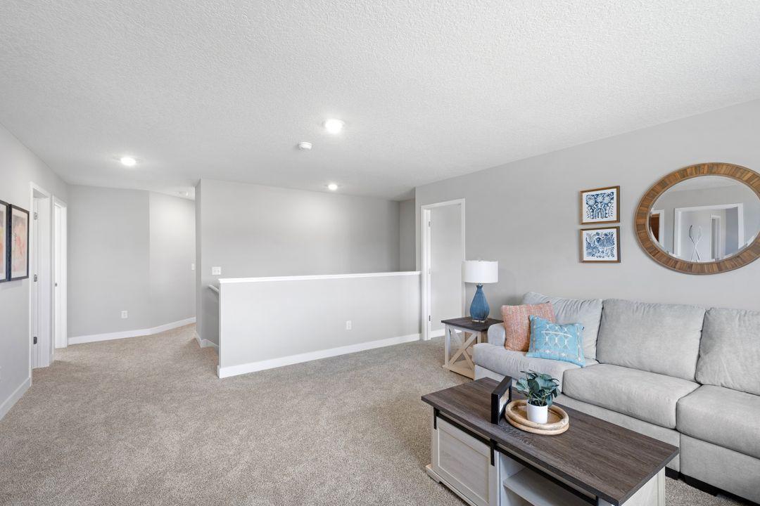 Here is a reverse view of the upper level loft. Photos of model home, colors and finishes may vary.
