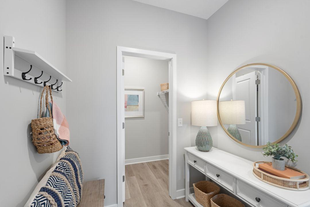 Your private garage entry includes a spacious mud room and a walk-in closet perfect for all of your outerwear, shoes, and bags. Photo of model, colors and finishes may vary.