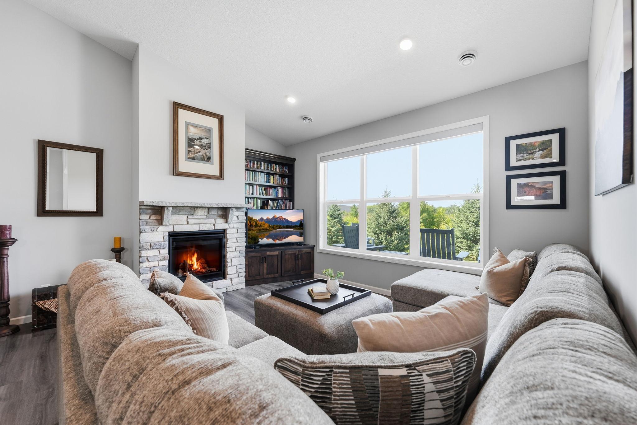 Spacious sunroom with fireplace and large windows