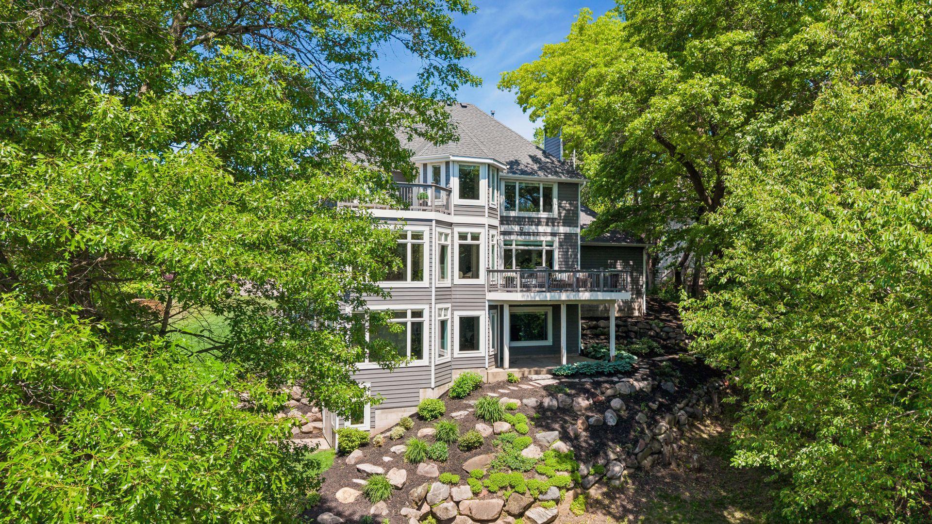 Enjoy breathtaking lake views from all three levels, with a hidden workshop tucked below for projects, storage, or hobbies.