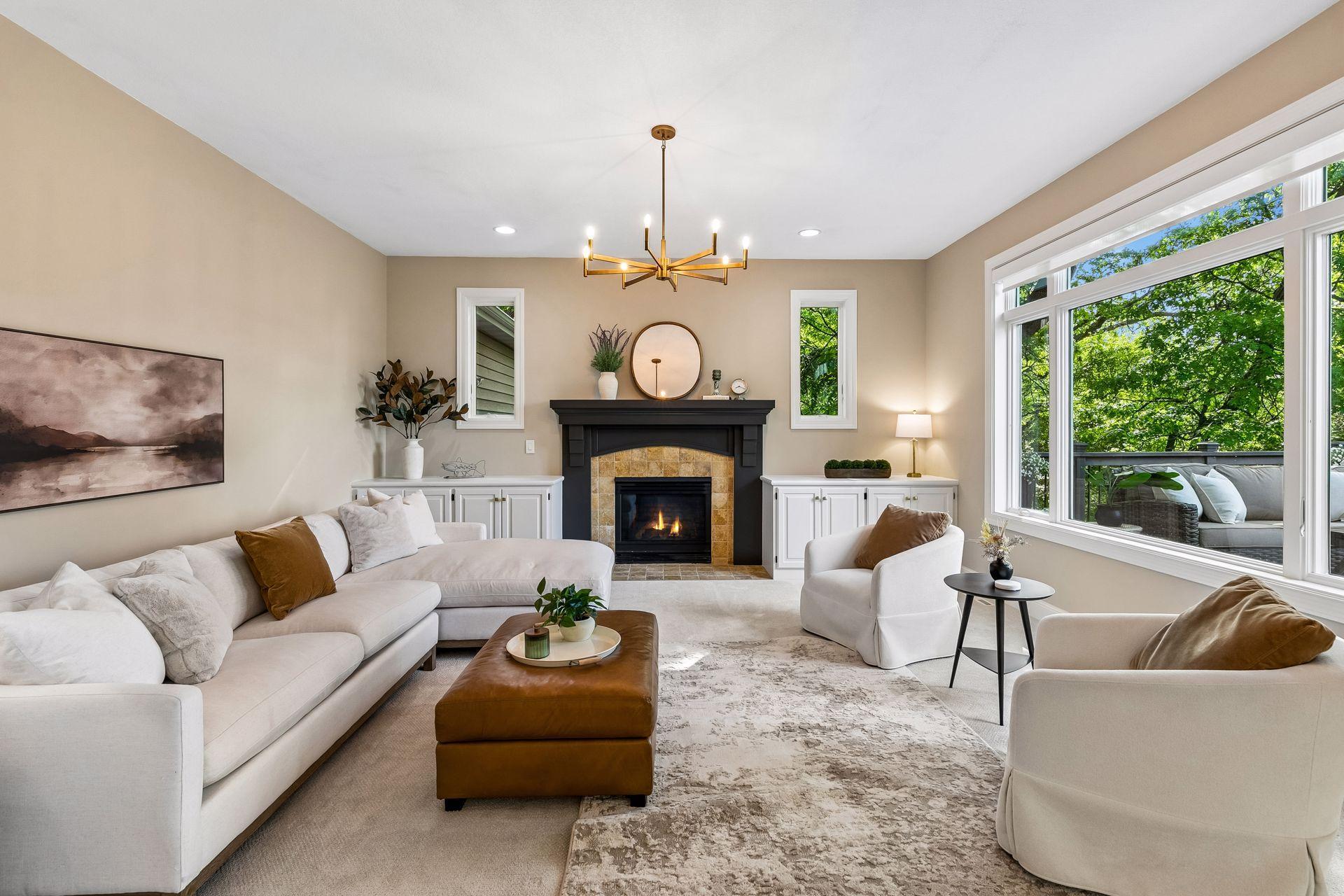 Modern, inviting, and warm, the living room features a cozy gas fireplace, overlooks the deck, and captures beautiful lake views.