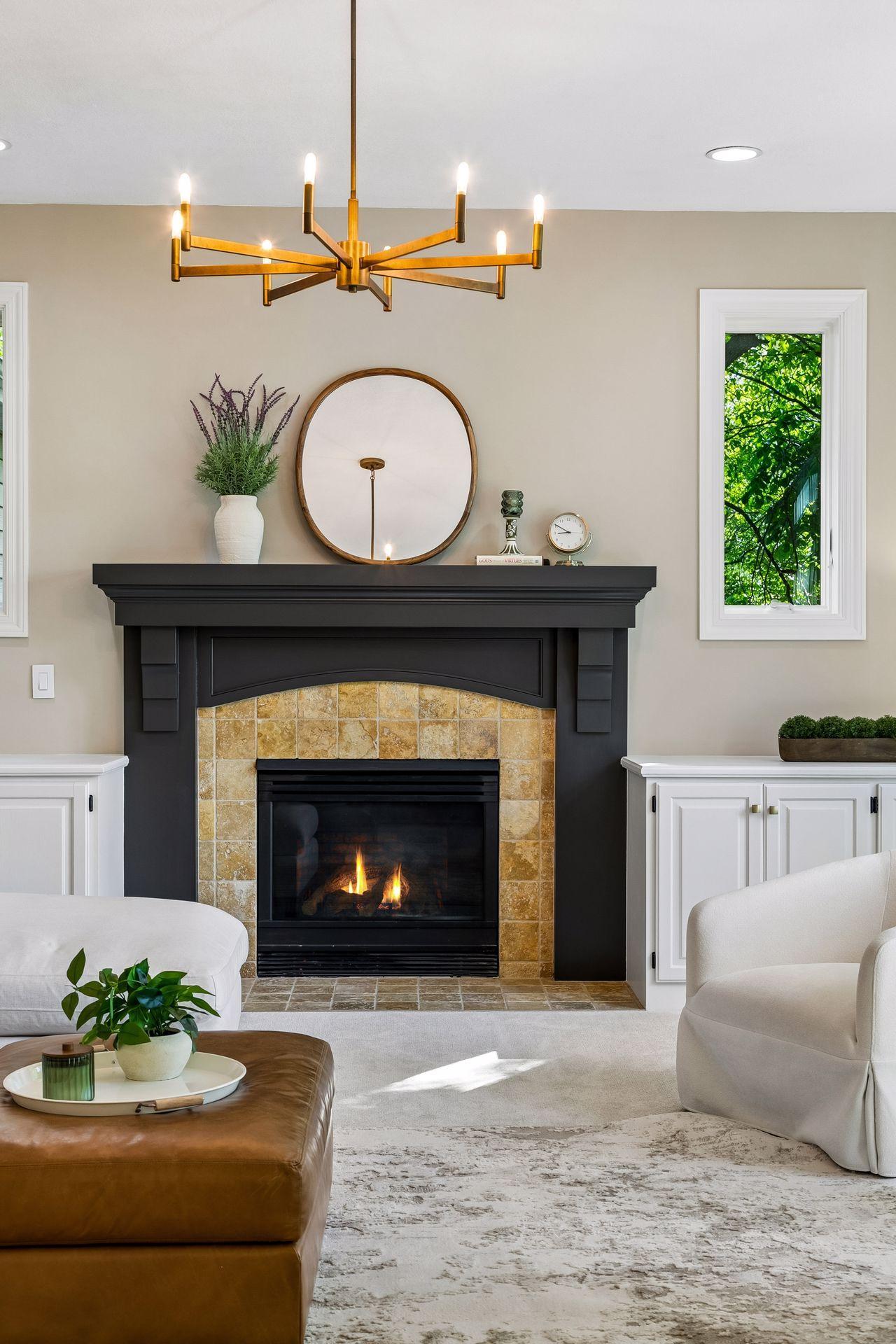 Modern, inviting, and warm, the living room features a cozy gas fireplace, overlooks the deck, and captures beautiful lake views.