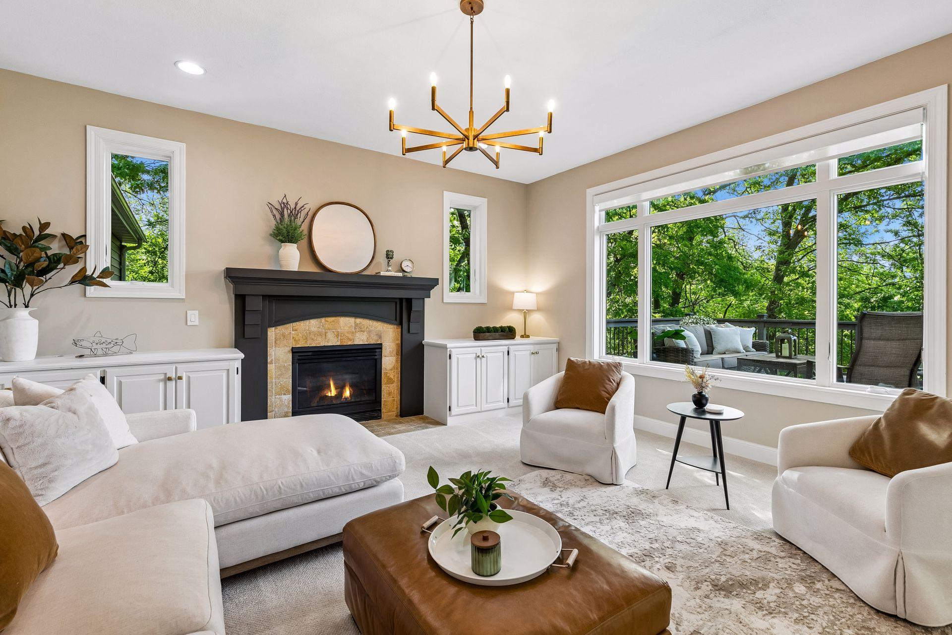 Modern, inviting, and warm, the living room features a cozy gas fireplace, overlooks the deck, and captures beautiful lake views.