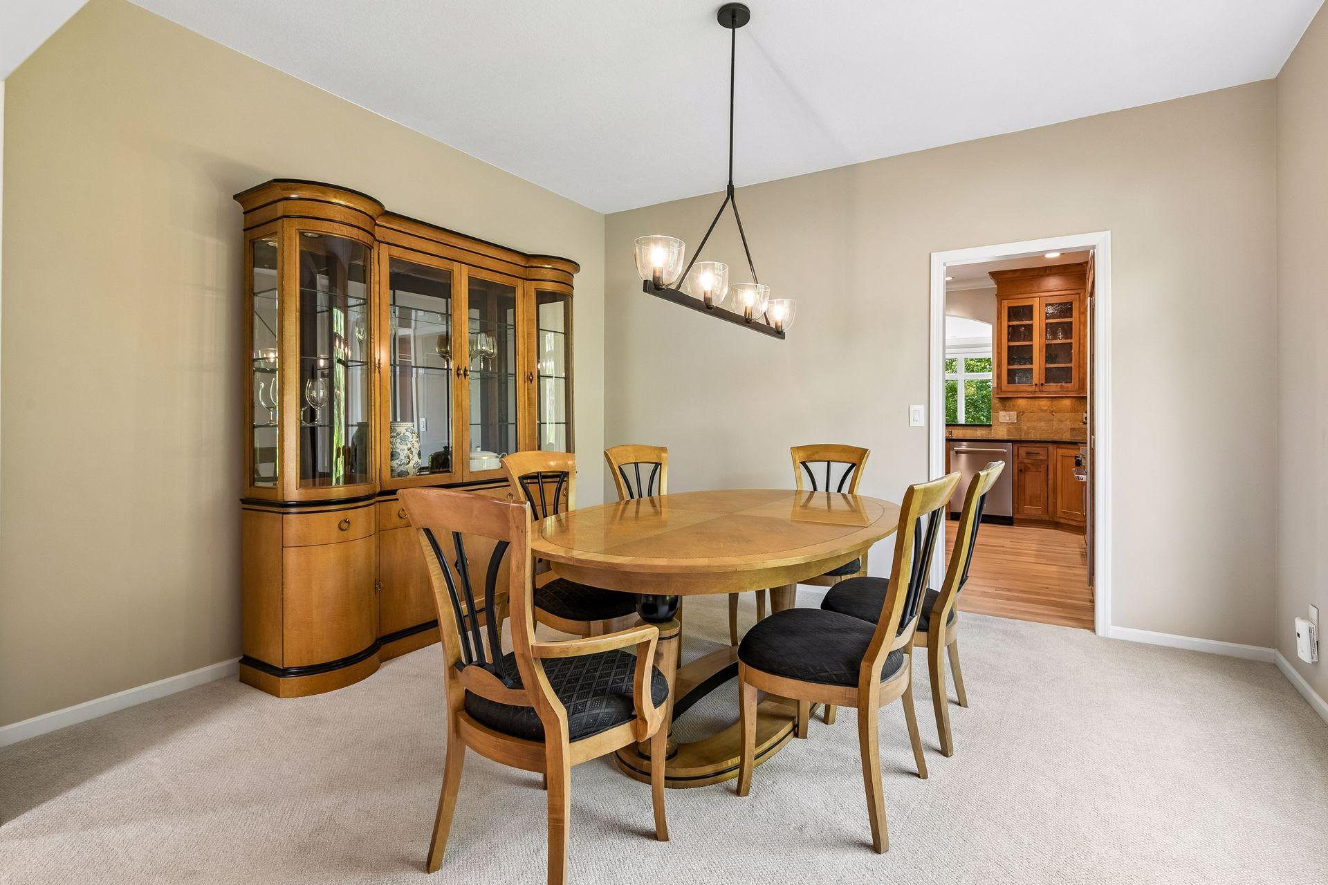A formal dining room provides the perfect setting for special gatherings, while the adjacent sitting room offers endless possibilities as an enclosed office, library, or flex space.