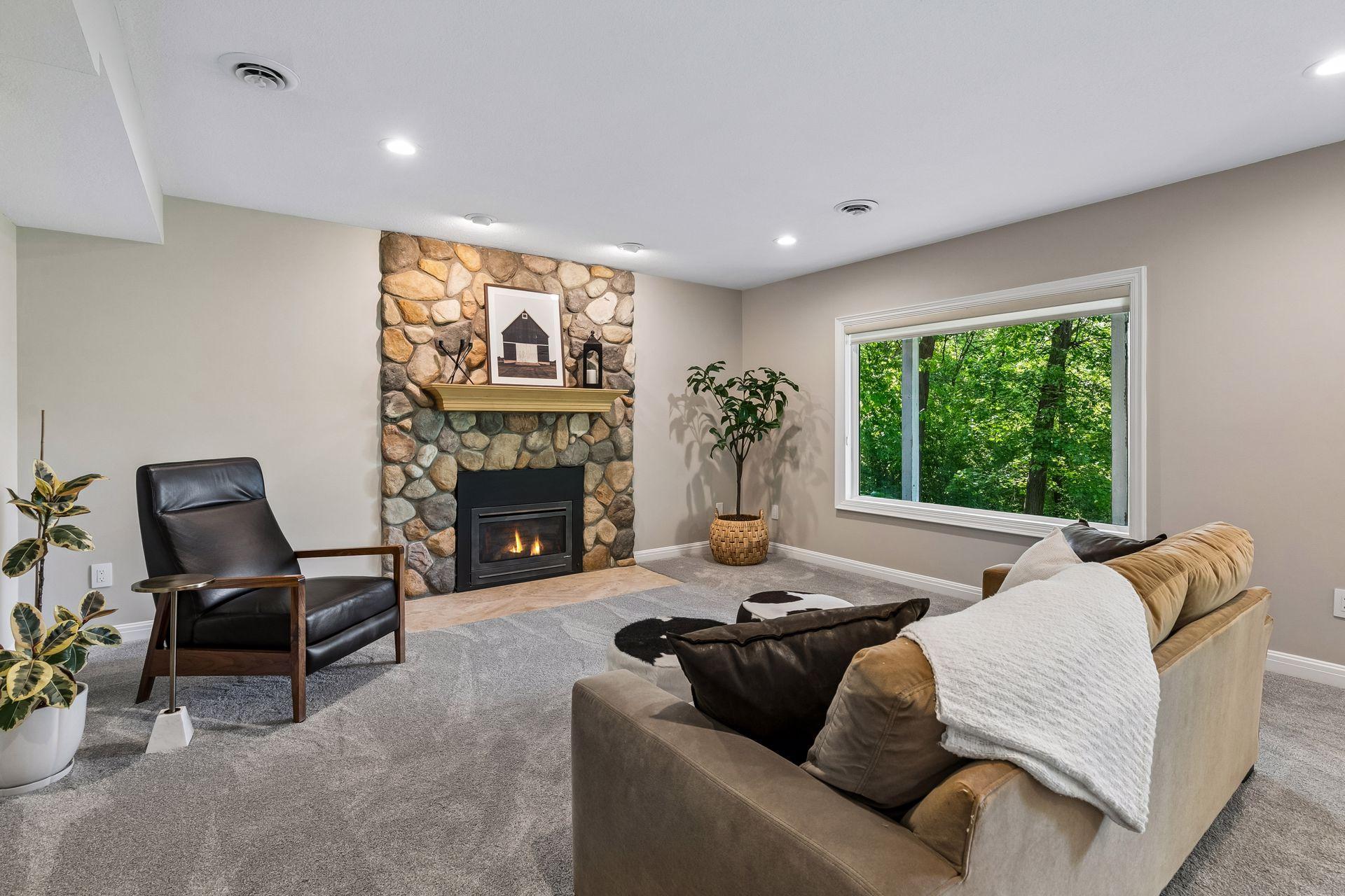 More views, more space, and more possibilities. The walkout lower level features a cozy family room with a gas fireplace and wet bar, a guest bedroom, bathroom, gym, and flexible play space that could easily be converted into an additional bedroom if