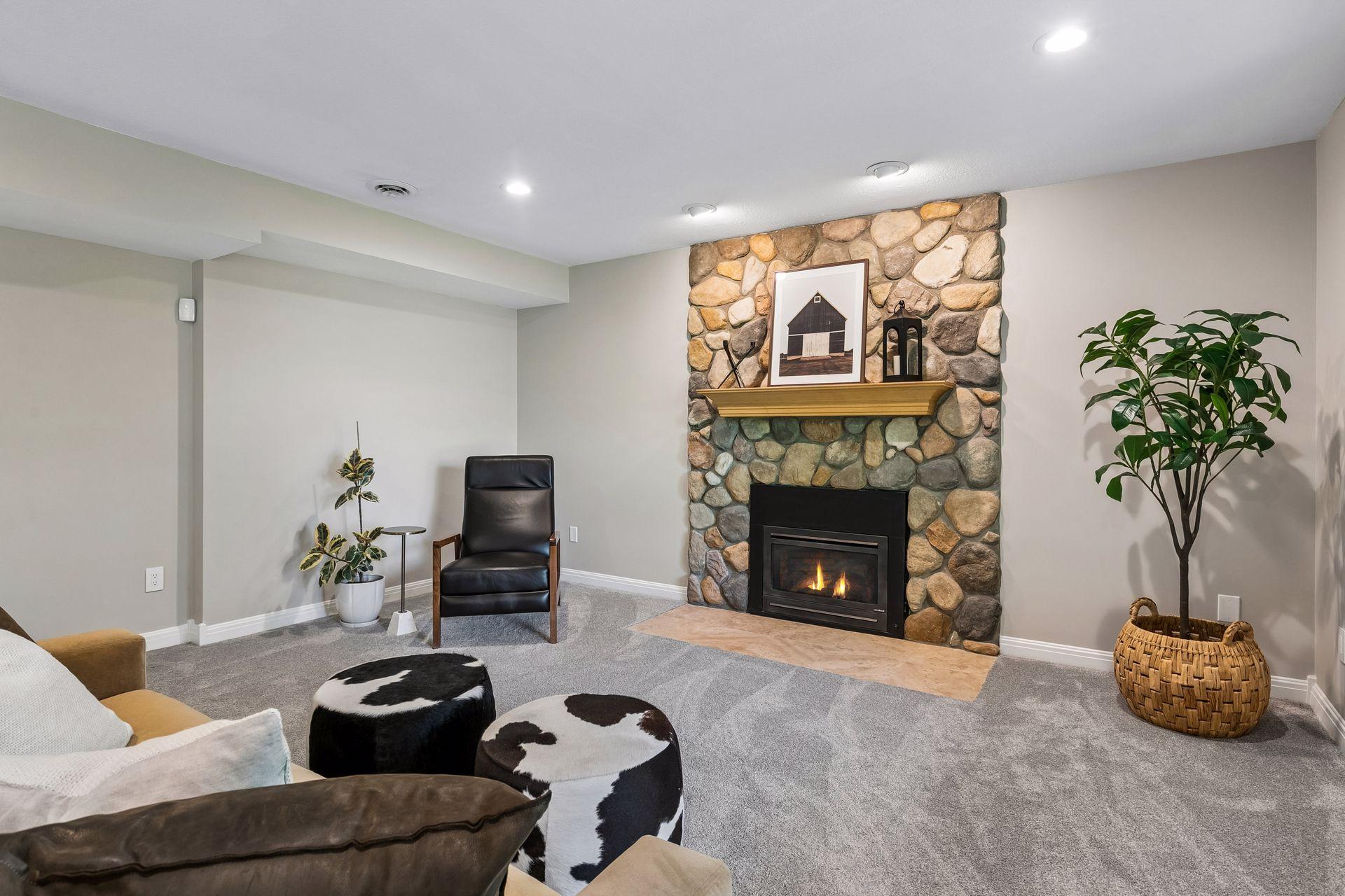 More views, more space, and more possibilities. The walkout lower level features a cozy family room with a gas fireplace and wet bar, a guest bedroom, bathroom, gym, and flexible play space that could easily be converted into an additional bedroom if