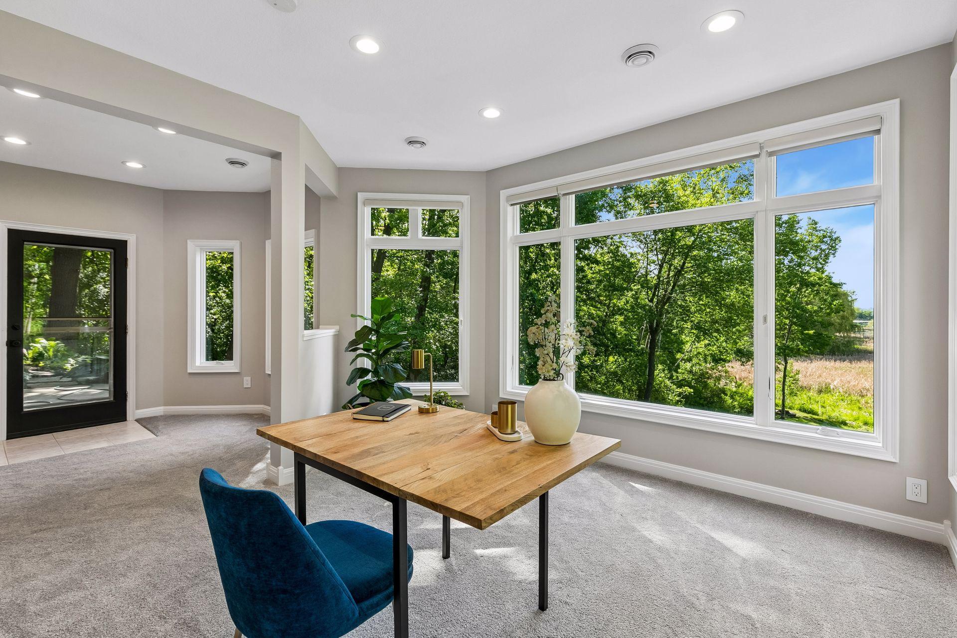More views, more space, and more possibilities. The walkout lower level features a cozy family room with a gas fireplace and wet bar, a guest bedroom, bathroom, gym, and flexible play space that could easily be converted into an additional bedroom if