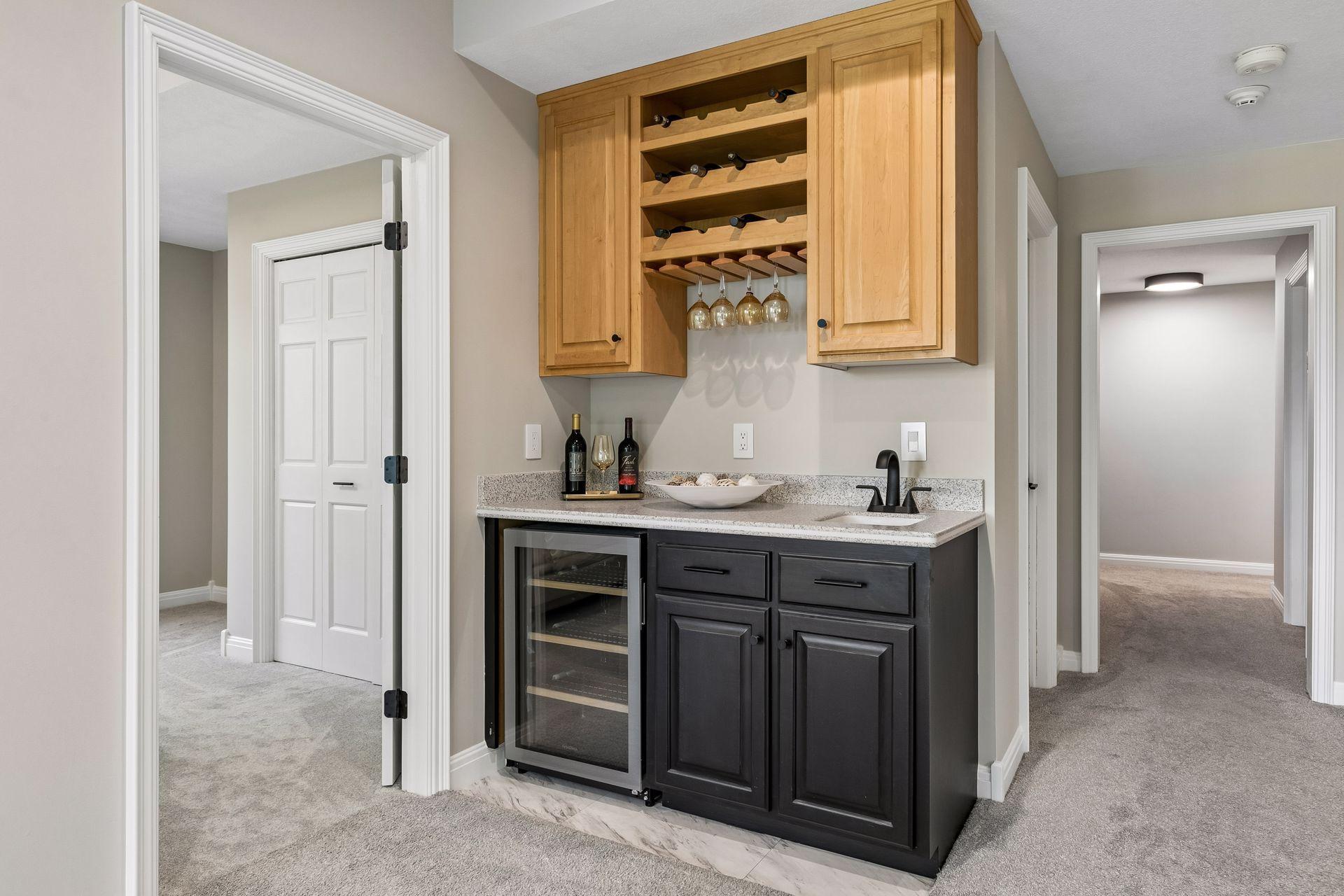 More views, more space, and more possibilities. The walkout lower level features a cozy family room with a gas fireplace and wet bar, a guest bedroom, bathroom, gym, and flexible play space that could easily be converted into an additional bedroom if