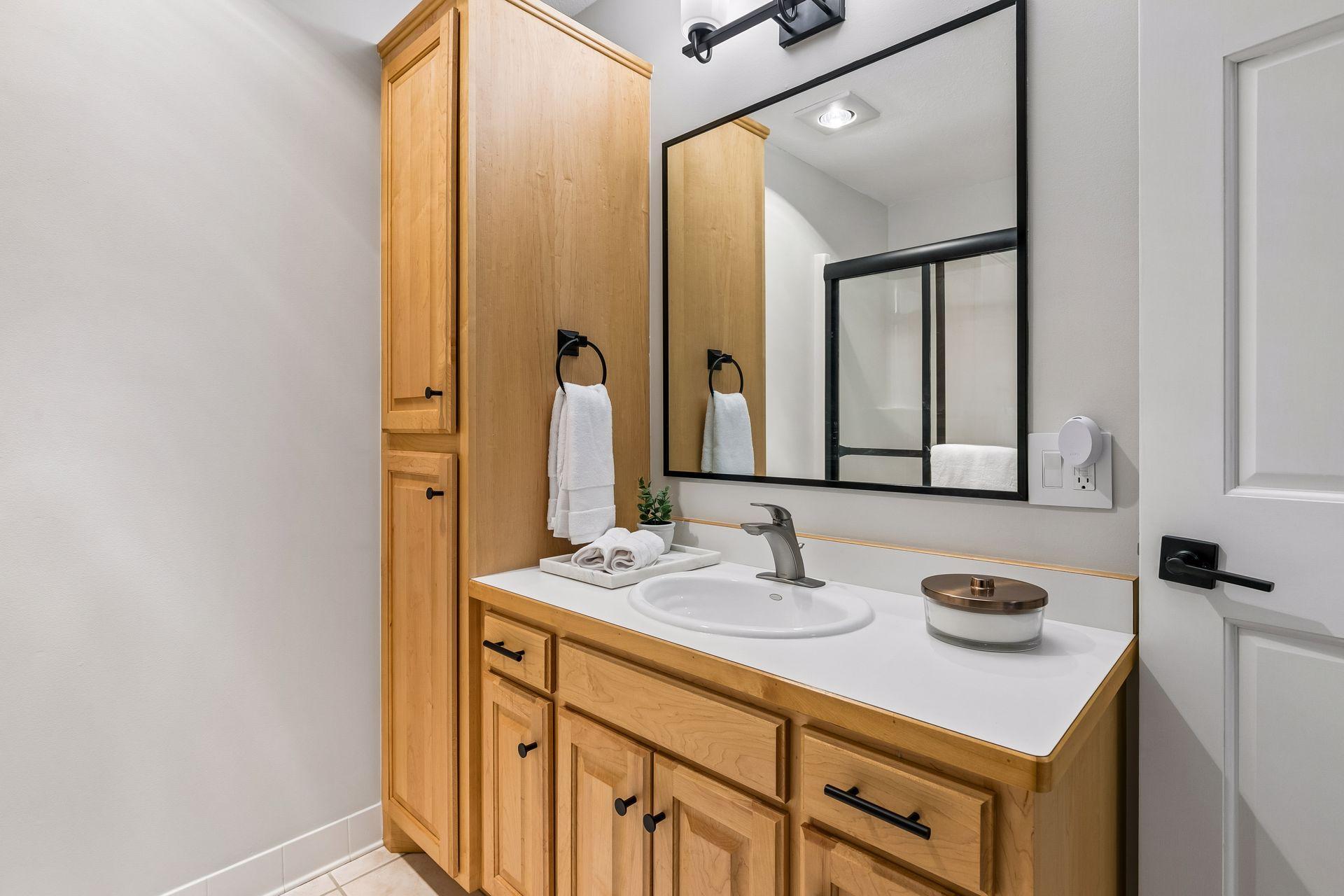 More views, more space, and more possibilities. The walkout lower level features a cozy family room with a gas fireplace and wet bar, a guest bedroom, bathroom, gym, and flexible play space that could easily be converted into an additional bedroom if