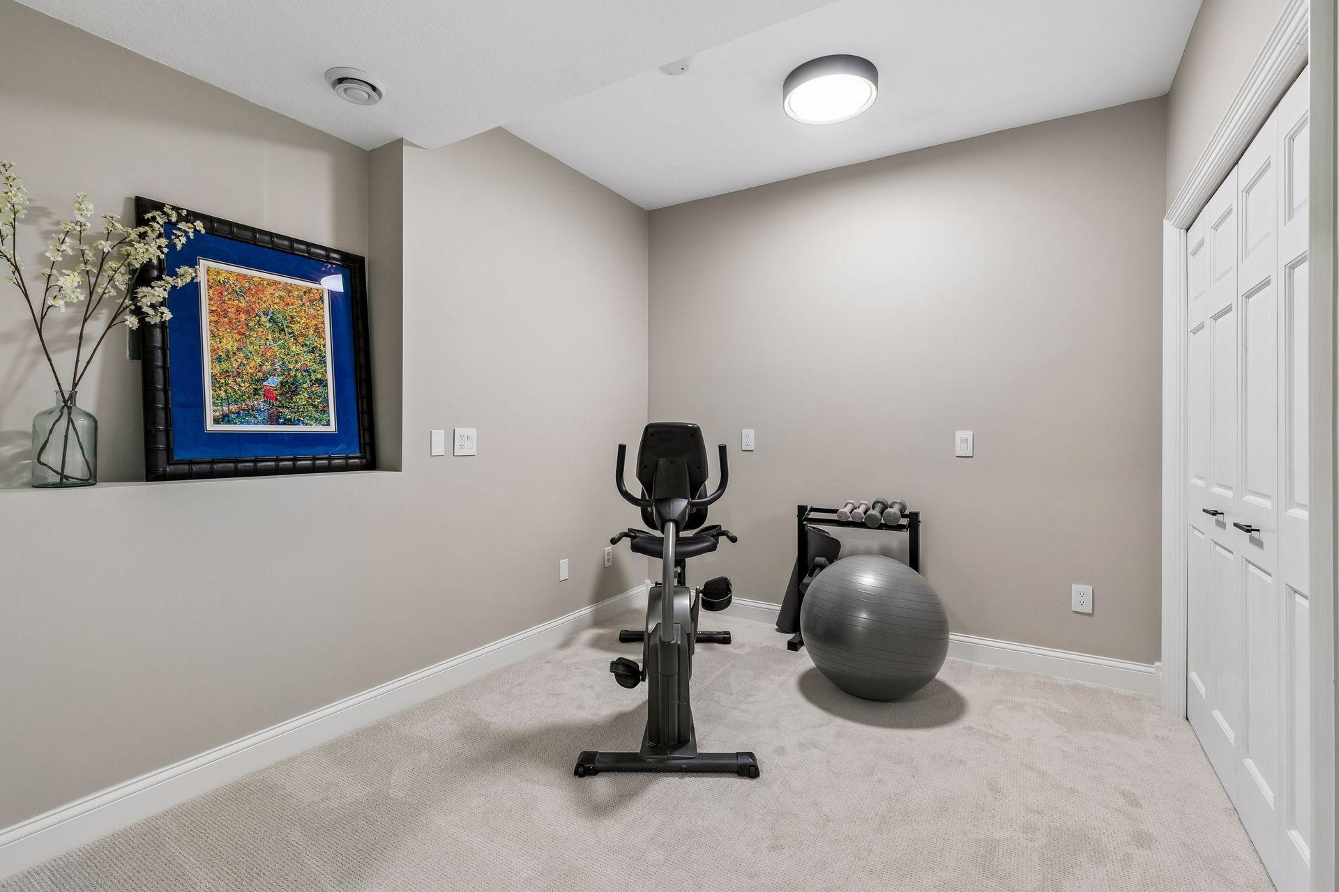 More views, more space, and more possibilities. The walkout lower level features a cozy family room with a gas fireplace and wet bar, a guest bedroom, bathroom, gym, and flexible play space that could easily be converted into an additional bedroom if