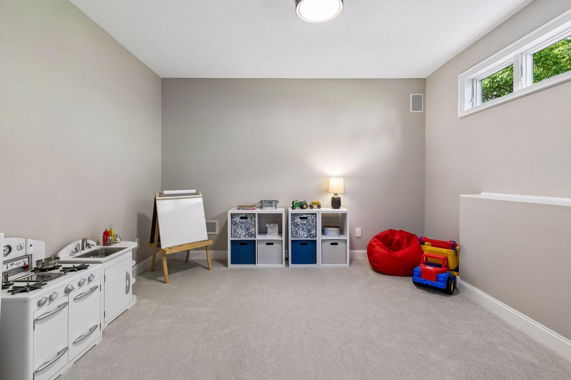 More views, more space, and more possibilities. The walkout lower level features a cozy family room with a gas fireplace and wet bar, a guest bedroom, bathroom, gym, and flexible play space that could easily be converted into an additional bedroom if