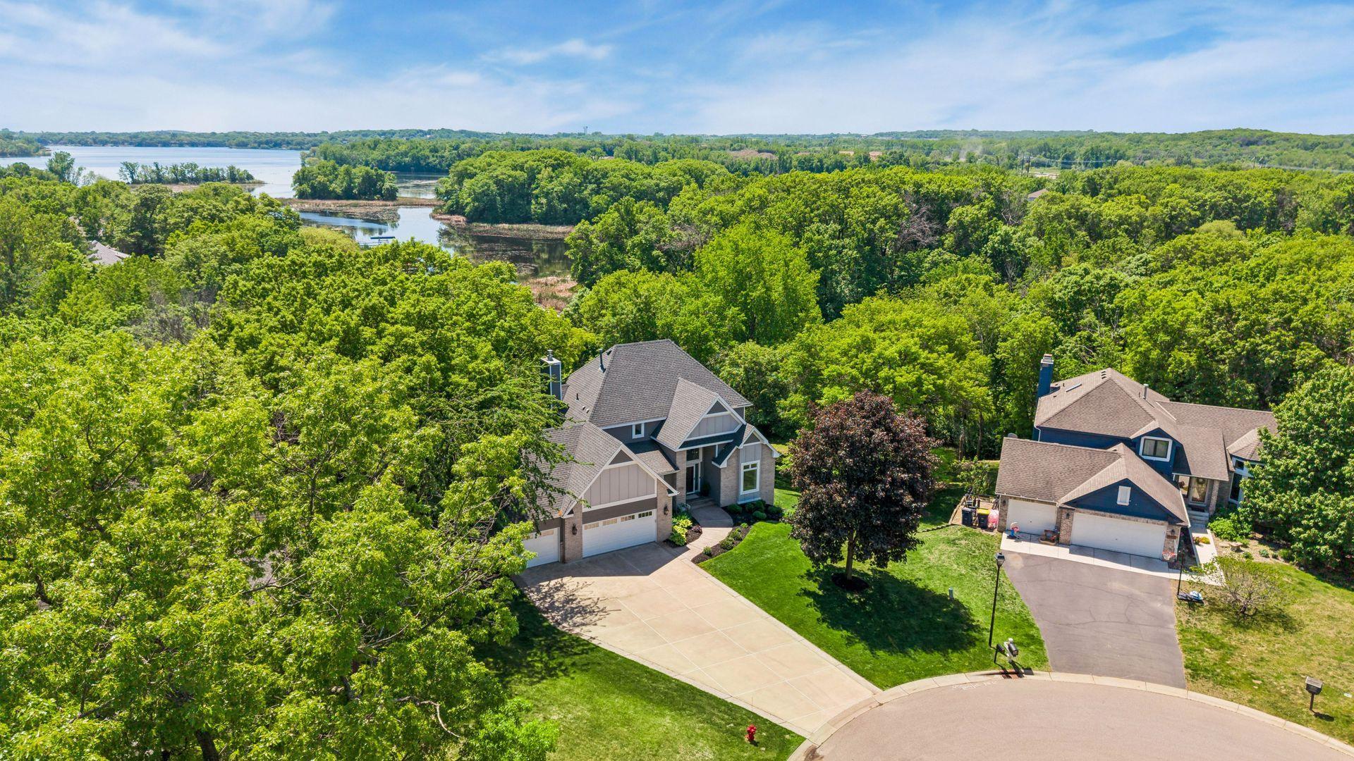 Welcome to 18706 Kanabec Court, a home designed to capture the beauty of Lake Marion from every level.