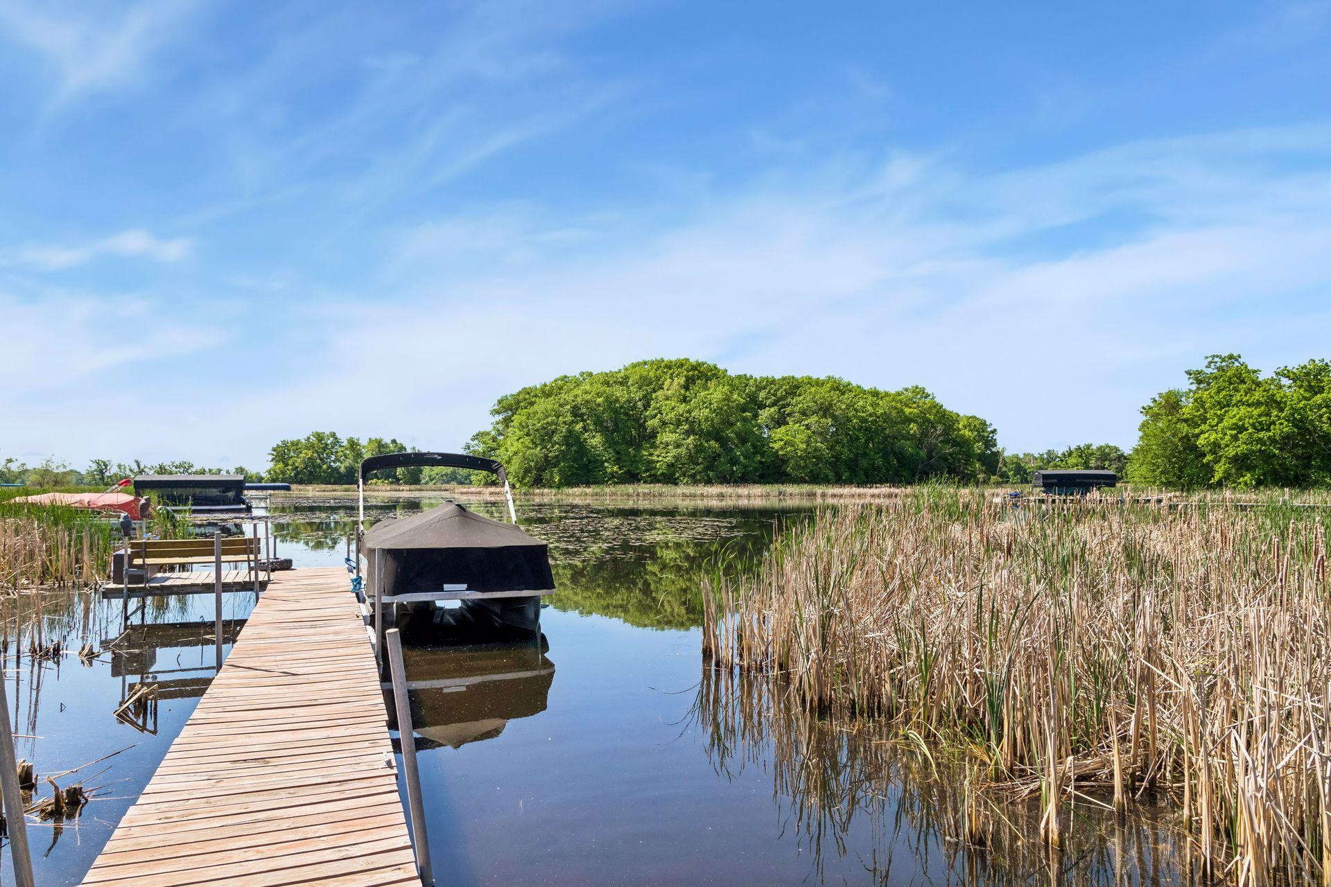 Shared dock with one neighboring property. Neighbor has expressed willingness to extend the dock if additional space is desired. Shared ownership helps reduce maintenance, repair, and improvement costs by splitting expenses between both owners.
