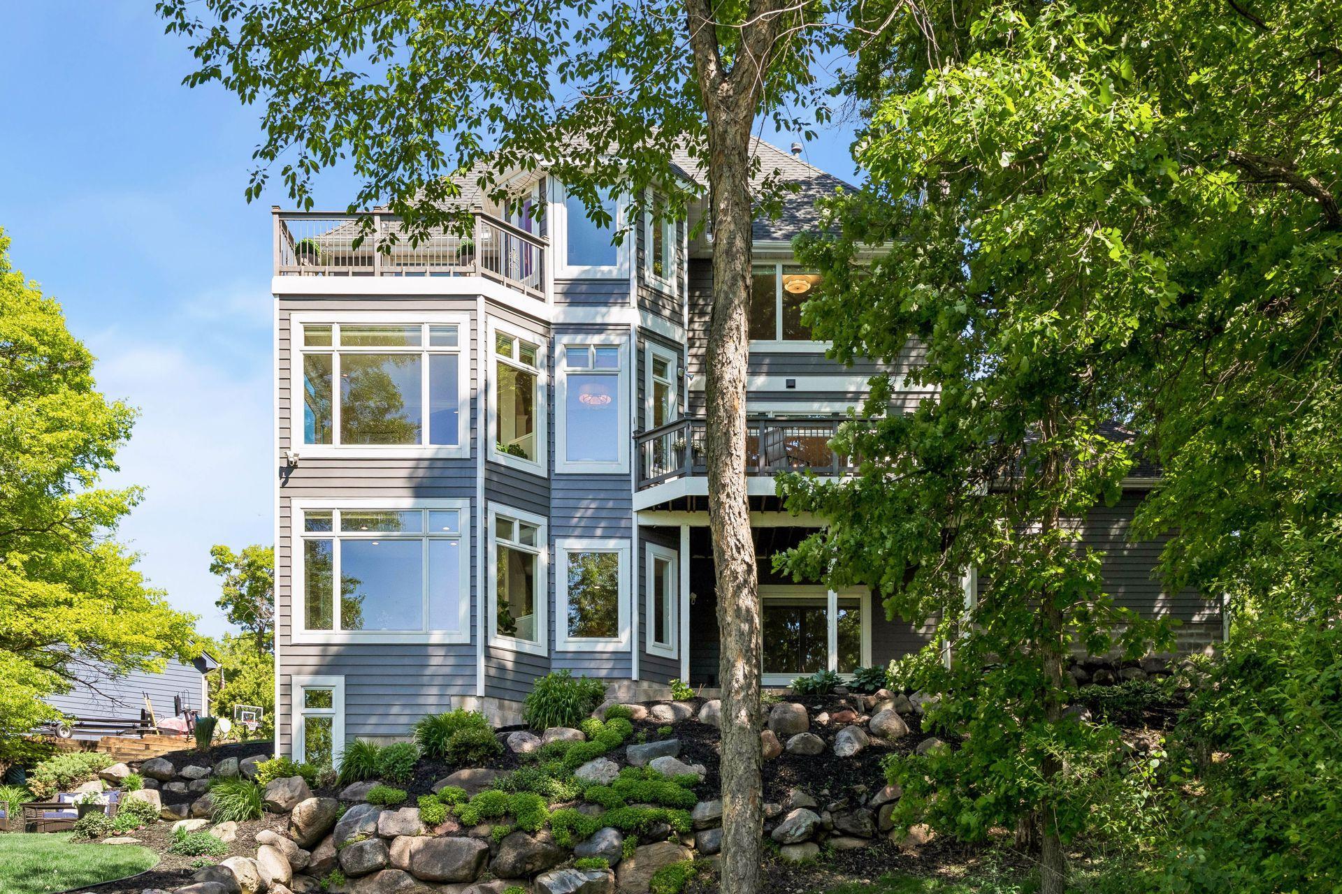 Enjoy breathtaking lake views from all three levels, with a hidden workshop tucked below for projects, storage, or hobbies.