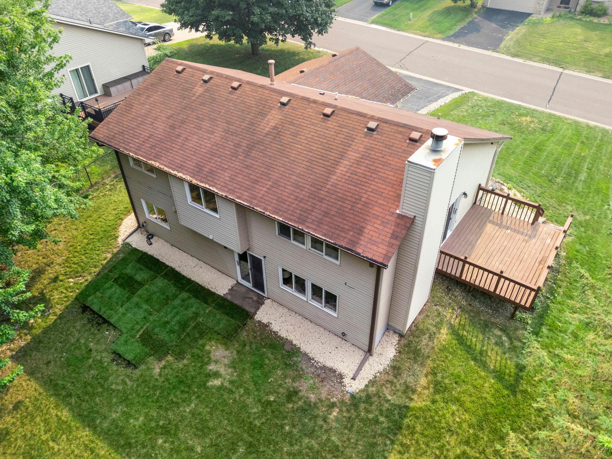 Additional features include an attached two-car garage with a new app-controlled opener, professional cleaning, a new furnace with humidifier (2023), new A/C (2020), chimney service (2026), TruGreen lawn care since 2016, and updated light fixtures.